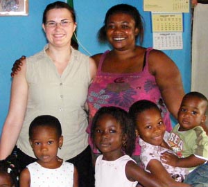Volunteer with her host family in Ghana