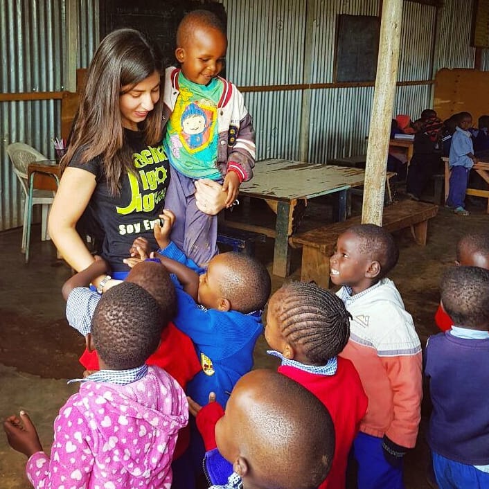  taking care of toddlers at an orphanage while volunteering