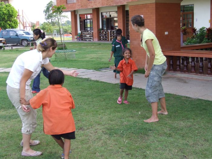 volunteers playing with children