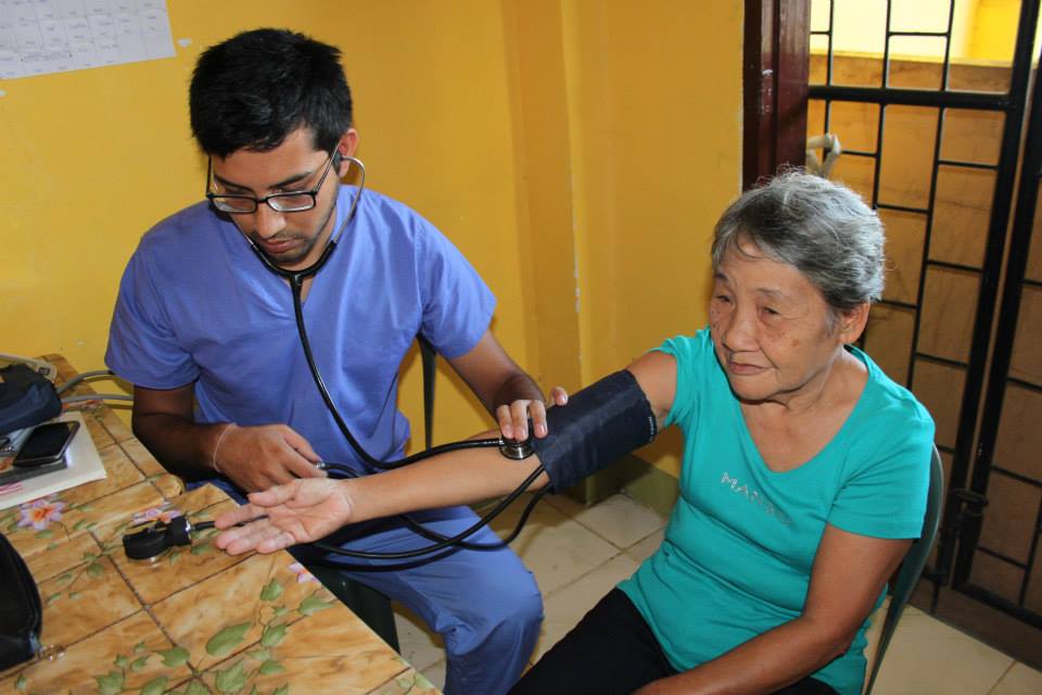 medical intern taking patient's blood pressure