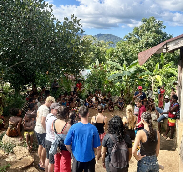 A group of Volunteering Solutions volunteers meeting local villagers and children at a community development project in Madagascar
