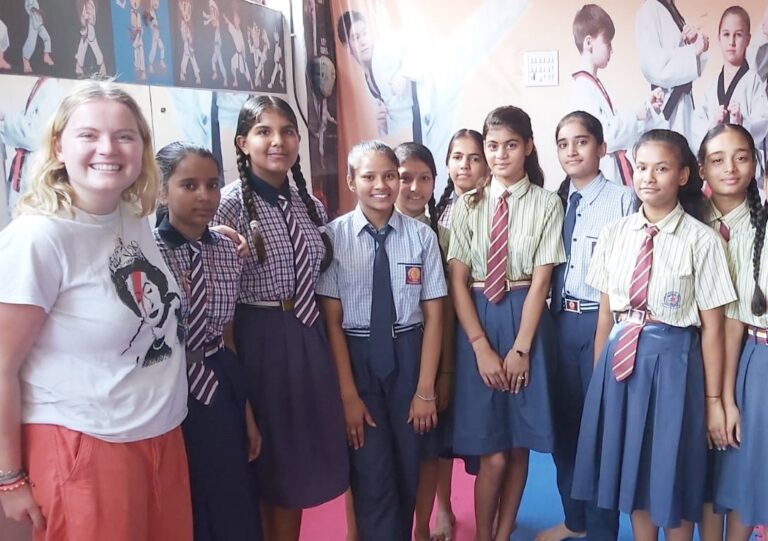 A volunteer with adolescent girls at the women's empowerment and girls' education project in Jaipur, India